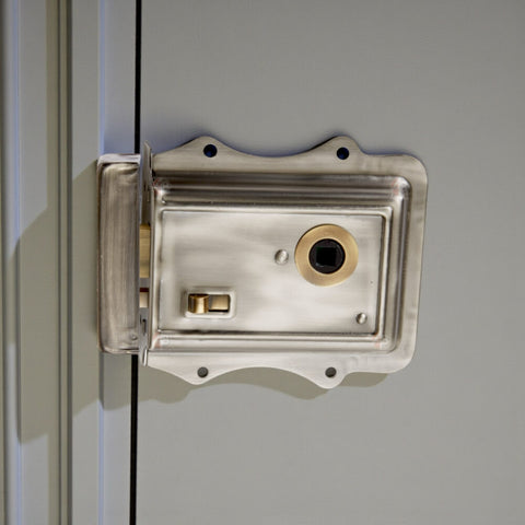Pewter and antique brass Victorian rim lock fitted to panelled interior door