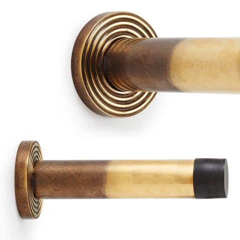 Solid Brass Cylinder Door Stop On Reeded Backplate - Aged Brass