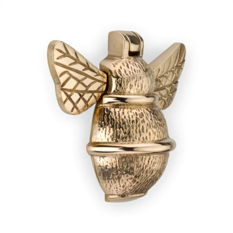 Unlacquered polished brass bumble bee door knocker, front view showing detailed wings and textured body.