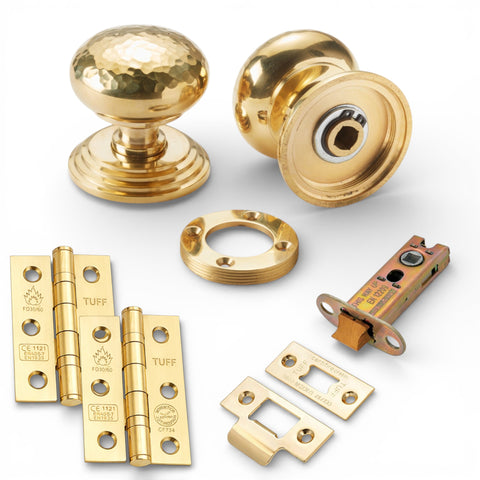 Unlacquered polished brass hammered mortice door knobs on stepped backplate latch pack with CE7 hinges and 3 inch heavy duty tubular latch