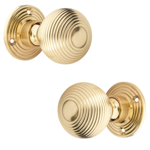 Polished Brass Hollow Beehive Door Knobs Pair Front and Side Angle View