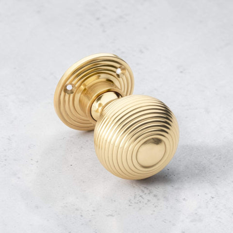 Close Up of Polished Brass Hollow Beehive Mortice Door Knob Detail