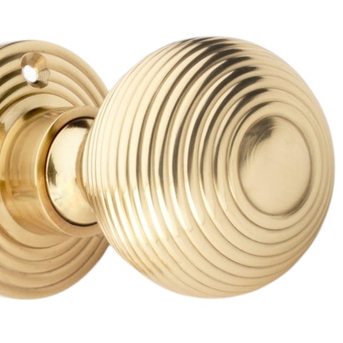 Close Up of Polished Brass Hollow Beehive Mortice Door Knob Detail