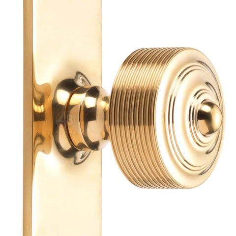 unlacquered polished brass reeded door knob on backplate solid brass traditional door hardware