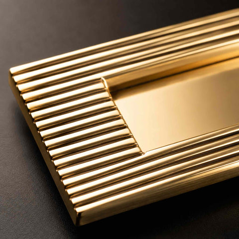 Detailed Corner Close-Up Showing Reeded Border and Polished Brass Finish