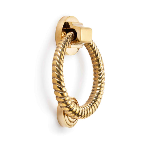 Polished brass reeded ring door knocker angled product view on a white background