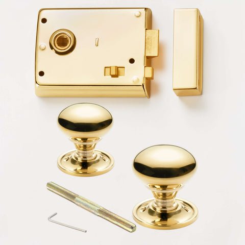 Polished brass rim latch lock with polished brass cottage door knobs