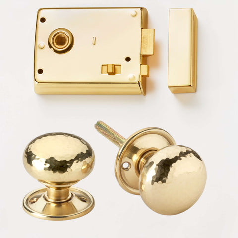 Polished brass rim latch lock with hammered brass cottage door knobs