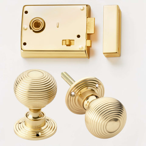 Polished brass rim latch lock with polished brass hollow beehive door knobs