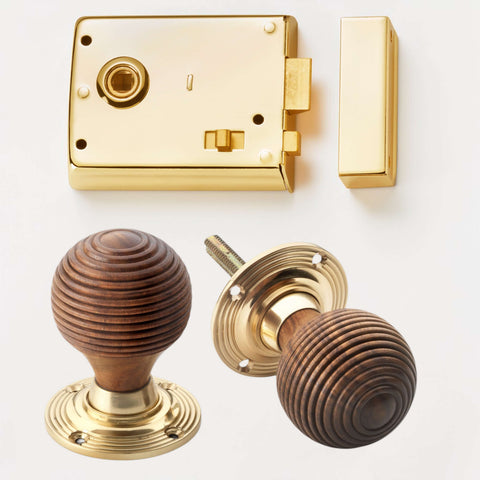 Polished brass rim latch lock with rosewood and brass beehive door knobs
