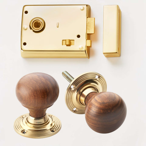Polished brass rim latch lock with rosewood and brass bun door knobs