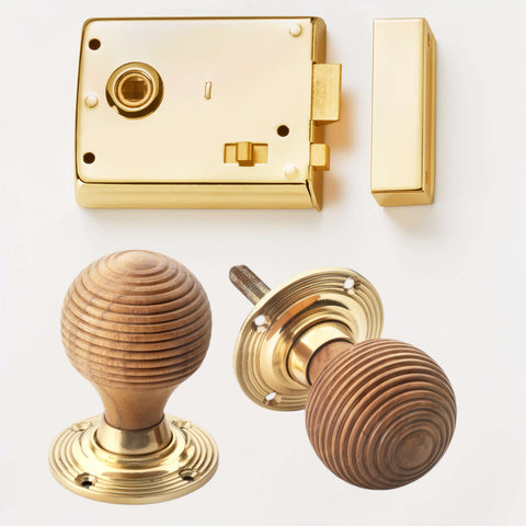 Polished brass rim latch lock with teak and brass beehive door knobs