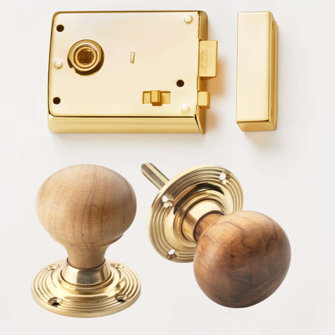 Polished brass rim latch lock with teak and brass bun door knobs
