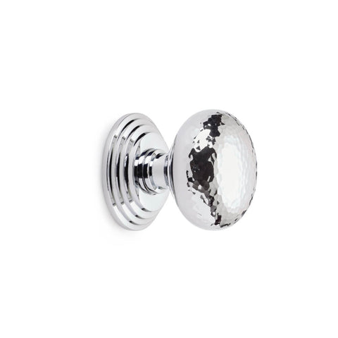 Hammered polished chrome cottage centre door knob with stepped backplate, side profile on white background