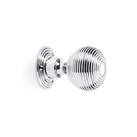 Side profile view of polished chrome reeded beehive mortice door knob with circular backplate.