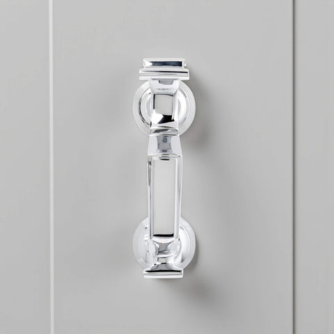 Front view of polished chrome reeded doctor door knocker on grey door, displaying traditional doctor style design and high shine chrome finish.