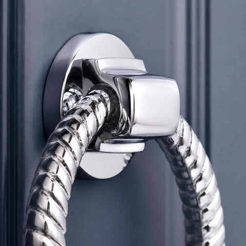 Close-up of polished chrome reeded ring door knocker fixing plate and mounting block