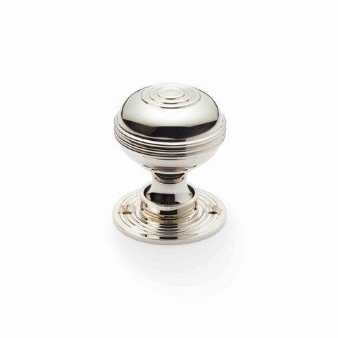 Single polished nickel Bloxwich mortice door knob with round rose backplate, supplied with fixing screw and concealed fixing system.