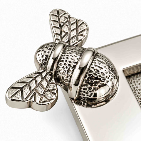 Close-up of polished nickel bumble bee detailing on the solid brass “LETTERS” letter plate