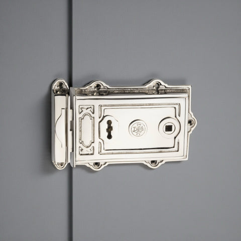 Polished nickel Davenport rim lock fitted to a painted internal door with matching keep