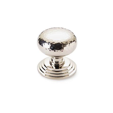 Hammered polished nickel cottage centre door knob with stepped circular backplate, front view on white background
