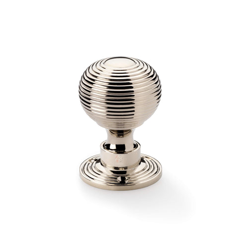 Single polished nickel reeded beehive mortice door knob on round rose backplate.