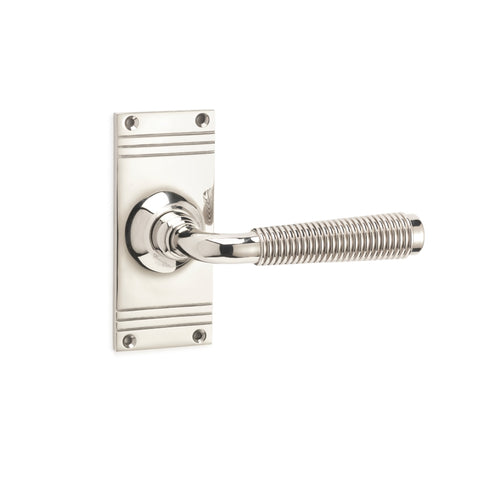 Single polished nickel reeded lever on backplate shown on white background