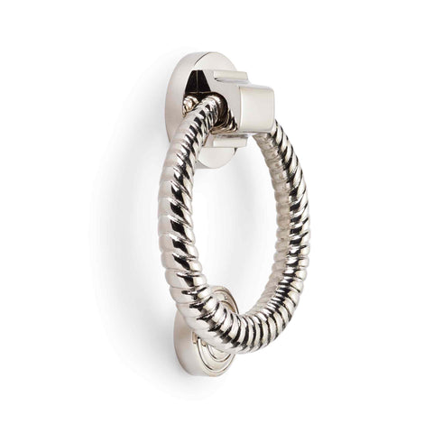 Polished nickel reeded ring door knocker mounted on a white background