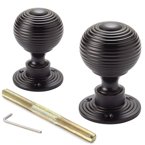 Pair of powder coated black reeded beehive rim mortice door knobs with threaded spindle and allen key included.