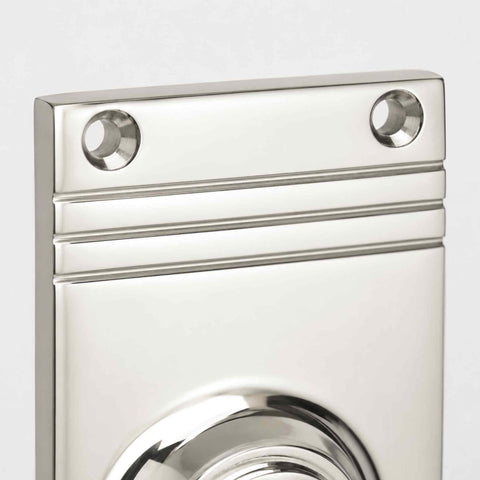 Macro close-up of the polished nickel reeded backplate.