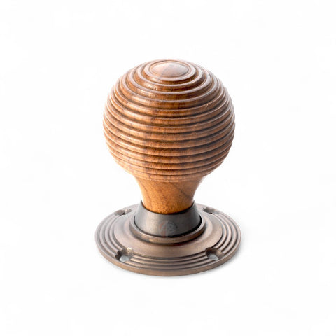 Rosewood matt antique beehive door knob on white background