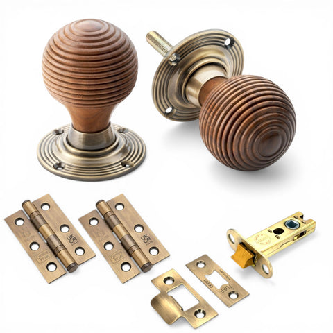 Rosewood beehive door knob pack with antique brass latch and CE7 hinges set on white background
