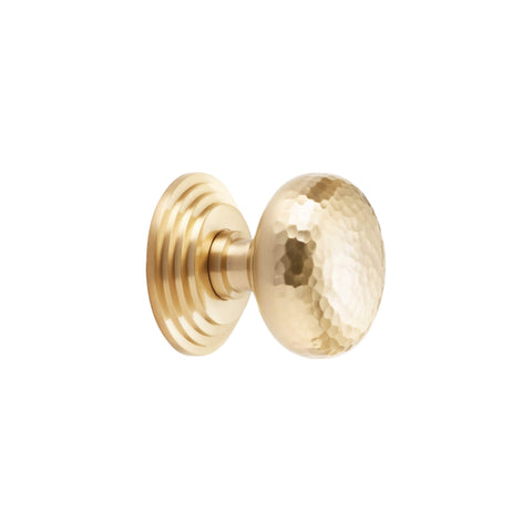 Satin brass hammered cottage centre door knob side profile showing domed hammered face and tiered rose