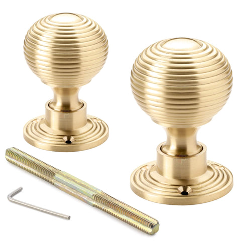 Pair of satin brass reeded beehive rim mortice door knobs with threaded spindle and allen key included.