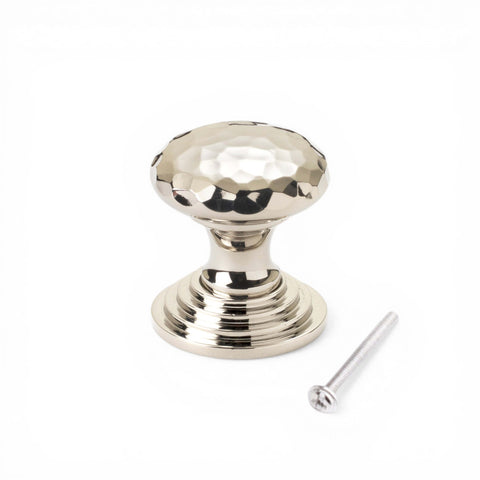 32mm solid polished nickel hammered cupboard knob with stepped backplate and fixing screw on white background