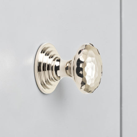 32mm solid polished nickel hammered cupboard knob with stepped backplate fitted to grey cabinet door