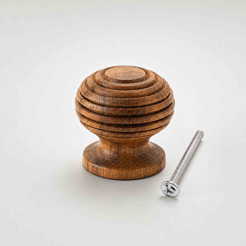Small 30mm rosewood beehive cupboard knob with fixing bolt displayed on a white background.