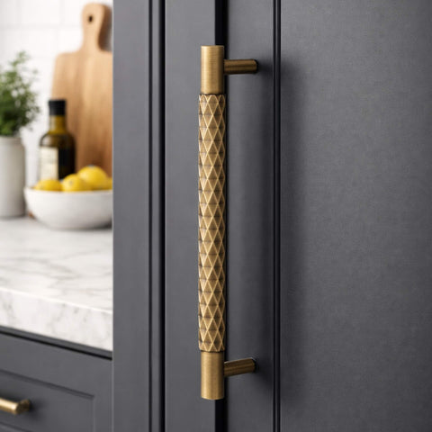 Antique brass diamond cut cabinet handle fitted to modern kitchen cupboard door