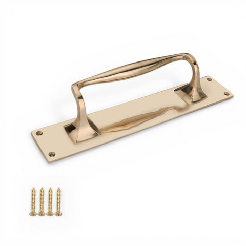 Solid brass door pull handle on backplate shown horizontally with four matching brass fixing screws included.