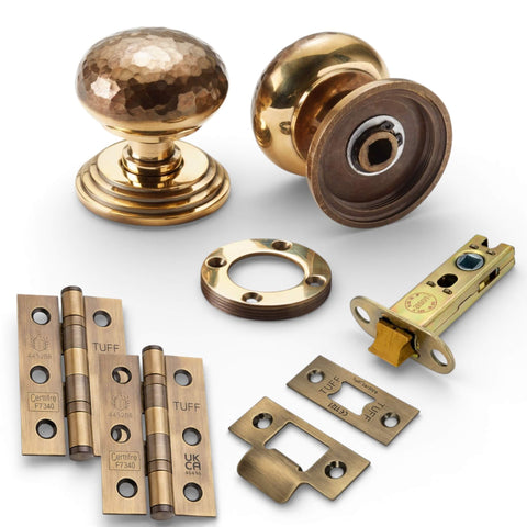 Solid brass hammered mortice door knobs on stepped backplate in aged brass latch pack with CE7 hinges and 3 inch heavy duty tubular latch
