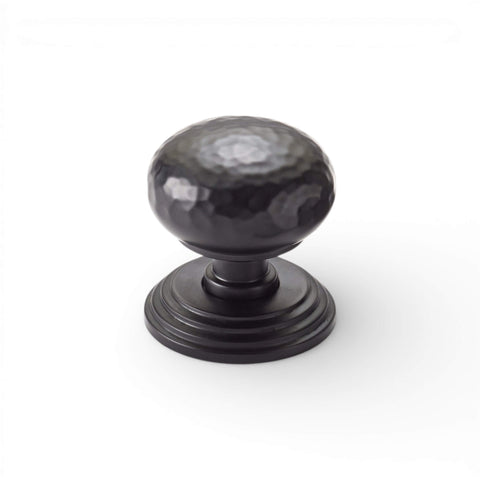 Hammered mortice door knob on stepped backplate in powder coated black finish