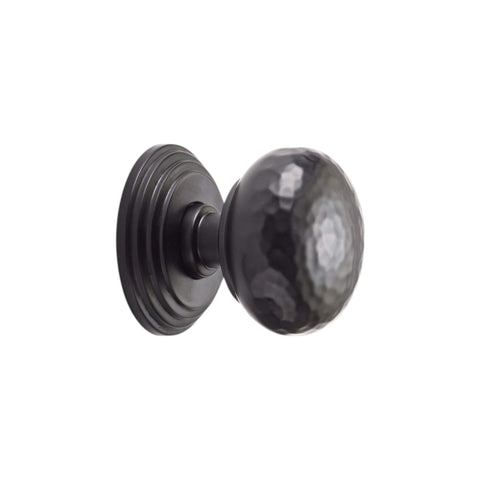 Side view of hammered mortice door knob on stepped backplate in powder coated black finish