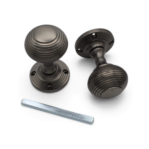 Pewter beehive mortice door knobs with 7mm spindle included, showing traditional ribbed design and fixing points.
