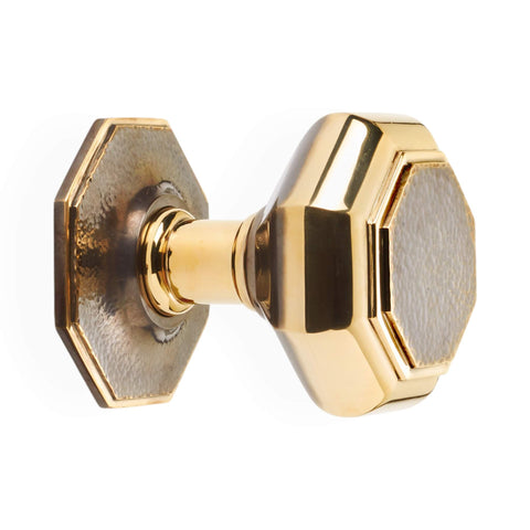Very large aged brass hammered octagonal centre door knob side profile showing stem and octagonal rose