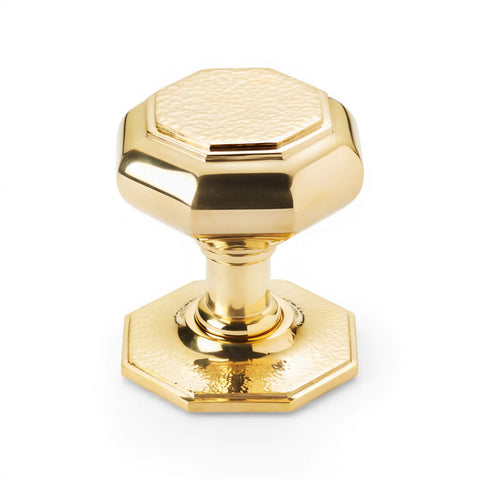 Very large polished brass hammered octagonal centre door knob front view with matching octagonal backplate