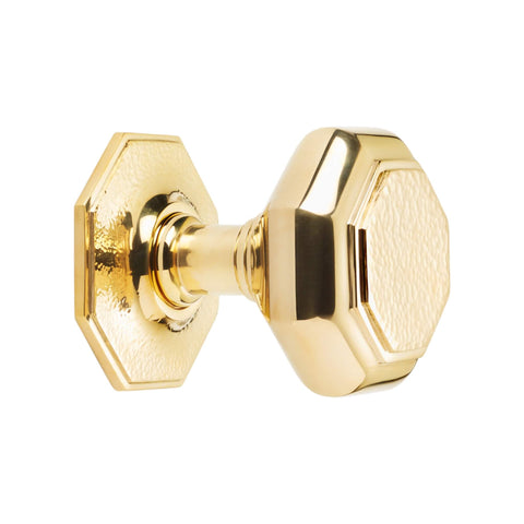 Very large polished brass hammered octagonal centre door knob side profile showing stem and octagonal rose